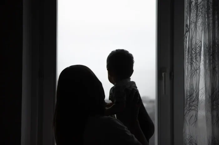 mother and son by the window