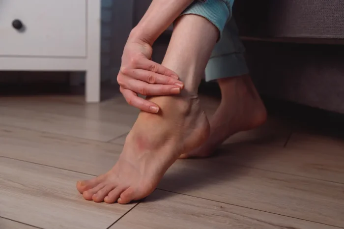woman massaging her feet