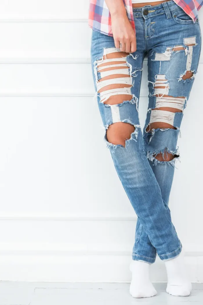 woman wearing ripped jeans