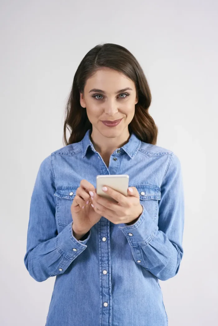 pretty woman replying to a text message