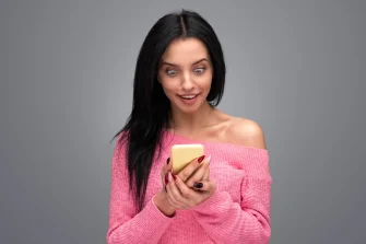 woman looking shocked at phone